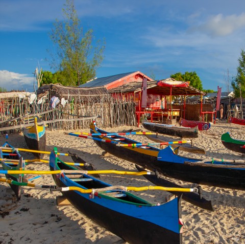 Photo Colourful pirogues on the beach par Philip Plisson